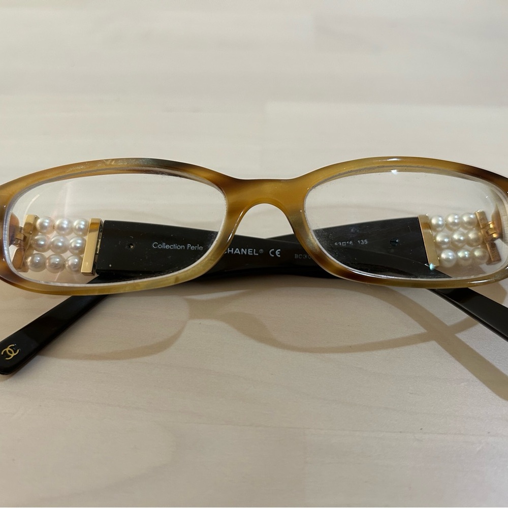 Chanel ladies glasses.  Beautiful pearls on the side.